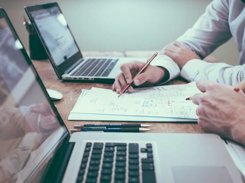 Accountant reviewing client records and financial documents